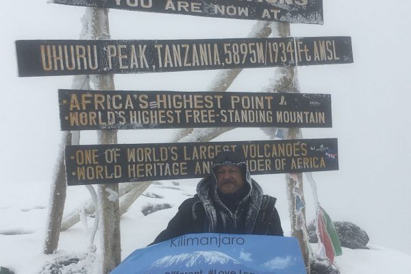 Byron reaches the top of the Kilimanjaro summit.